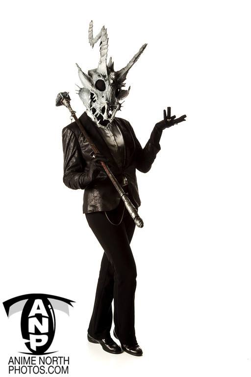 Skull headed demon cosplay with suit and chain